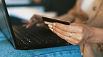 Credit card, hands and woman with laptop for online shopping, internet banking and website deal. Home, apartment and person with debit info on computer for digital purchase, payment and ecommerce