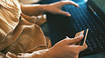 Credit card, hands and woman with laptop in home for online shopping, internet banking and deal. Typing, apartment and person with debit info on computer for digital purchase, payment and ecommerce