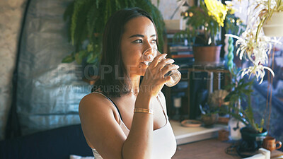 Buy stock photo Drinking, woman and glass with water in home for liquid hydration, natural nutrients and body detox. Diet, person and relax with aqua beverage in apartment for refreshing drink, thirsty and wellness
