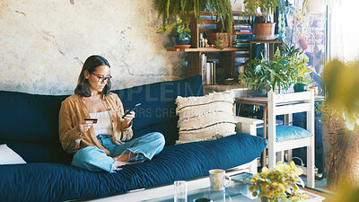 Buy stock photo Debit card, sofa and woman with phone for online shopping, internet banking and website deal. Home, apartment and person with credit info on smartphone for digital purchase, payment and ecommerce