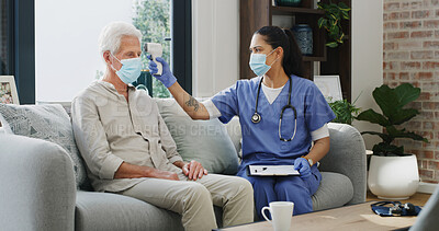 Buy stock photo Home, covid and nurse with old man, thermometer or healthcare with virus prevention. Pensioner, senior patient or medical service with safety, face mask or checkup with regulation or monitoring fever