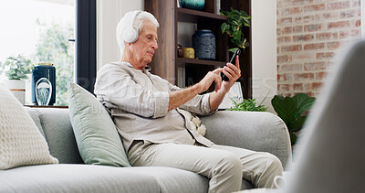Buy stock photo Music, phone and relax with old man on sofa in living room of home for streaming subscription. App, headphones and retirement with senior person in apartment for audio or sound entertainment