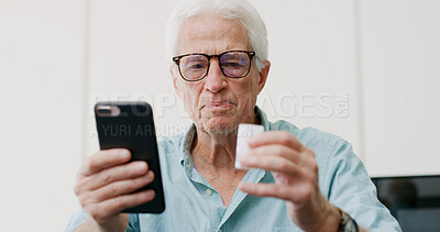 Buy stock photo Medicine, pills and phone with old man in home for dosage instruction, reading and side effects. Research, online pharmacy and medical information with senior person in apartment for prescription