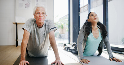 Buy stock photo Fitness, stretching or yoga with old man and physiotherapist in studio for rehabilitation routine. Exercise, recovery or support with practitioner and senior patient in session for wellness therapy