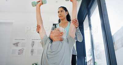 Buy stock photo Dumbbells, fitness or strength training with old man and physiotherapist in studio for rehabilitation. Exercise, recovery or weightlifting with practitioner and senior patient in session for therapy