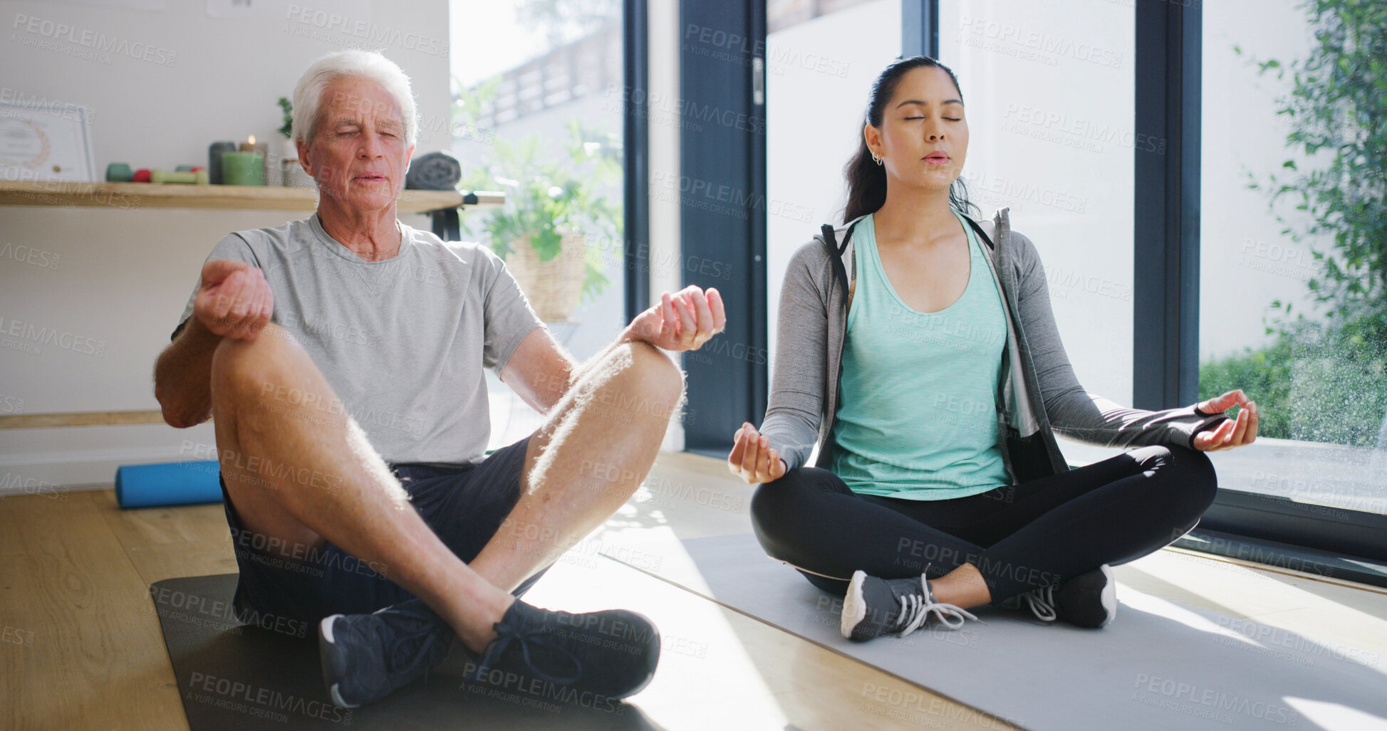 Buy stock photo Fitness, meditation or yoga with old man and physiotherapist in studio for rehabilitation routine. Breathing, exercise or recovery with practitioner and senior patient in session for wellness therapy