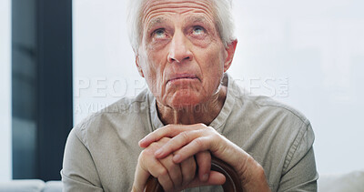 Buy stock photo Mental health, thinking or old man on sofa with walking stick, fear or memory of past trauma in living room. Reflection, anxiety or senior person in home with wood cane, worry or stress in retirement