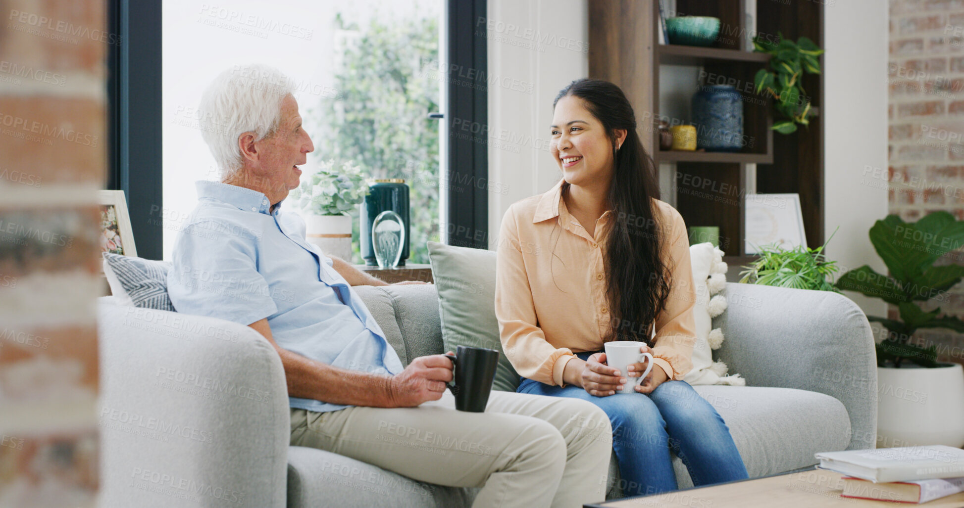 Buy stock photo Happy, coffee and daughter with old man on sofa for support, reunion and bonding. Retirement home, love and relax with senior father and woman in living room of apartment for family visit and tea