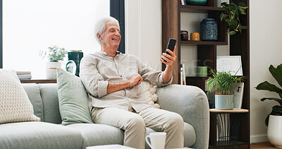 Buy stock photo Phone, laugh and senior man on sofa in home with reading news update on mobile app on weekend. Happy, technology and elderly male person relaxing in living room with online blog on cellphone in house