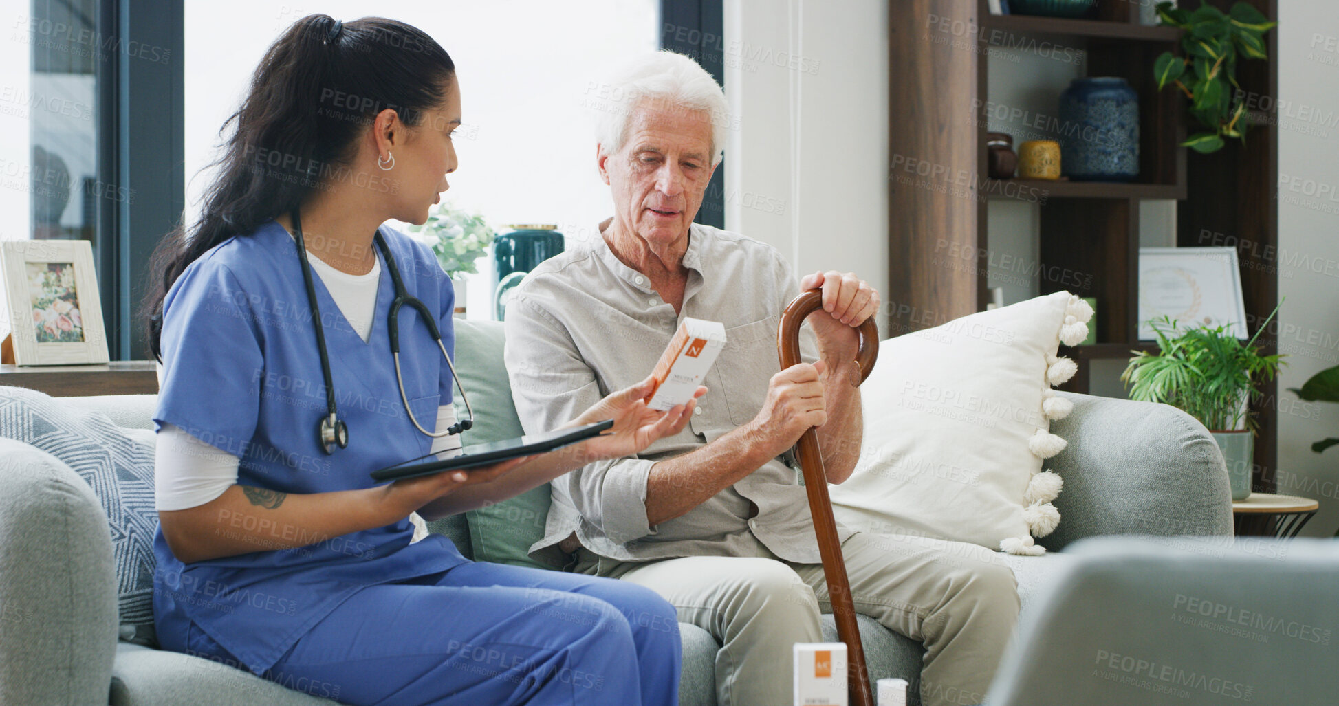 Buy stock photo Nurse, pills and tablet with old man on sofa for medical treatment, support or consulting. Medicine, digital schedule and caregiver with senior patient and woman in living room of home for advice