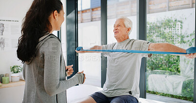 Buy stock photo Resistance band, stretching and old man with physiotherapist, muscle recovery and consultation. Mature patient, people and equipment with wellness, rehabilitation and medical service with strength