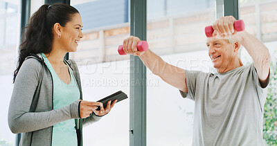 Buy stock photo Physiotherapist, stretching and old man with dumbbells, tablet and appointment with healthcare. Fitness, senior patient and woman with tech, support and help with recovery, weightlifting and healing