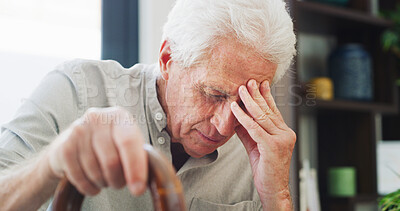Buy stock photo Headache, thinking and old man in house with cane, fatigue or memory of past mistake in living room. Mental health, grief or senior person in home with walking stick, migraine or regret in retirement