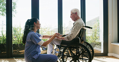 Buy stock photo Holding hands, nurse and senior man with wheelchair, support and counseling in nursing home. Healthcare, caregiver and elderly person with disability, conversation and comfort for care in retirement