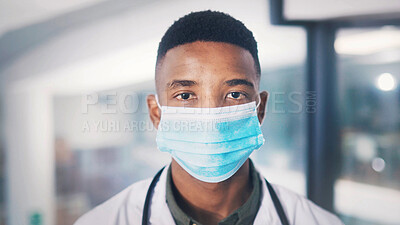 Buy stock photo Portrait, black man and doctor with face mask at hospital for protection, medical procedure and ppe. Male surgeon, disposable gear and rules to control disease, healthcare risk and hygiene compliance