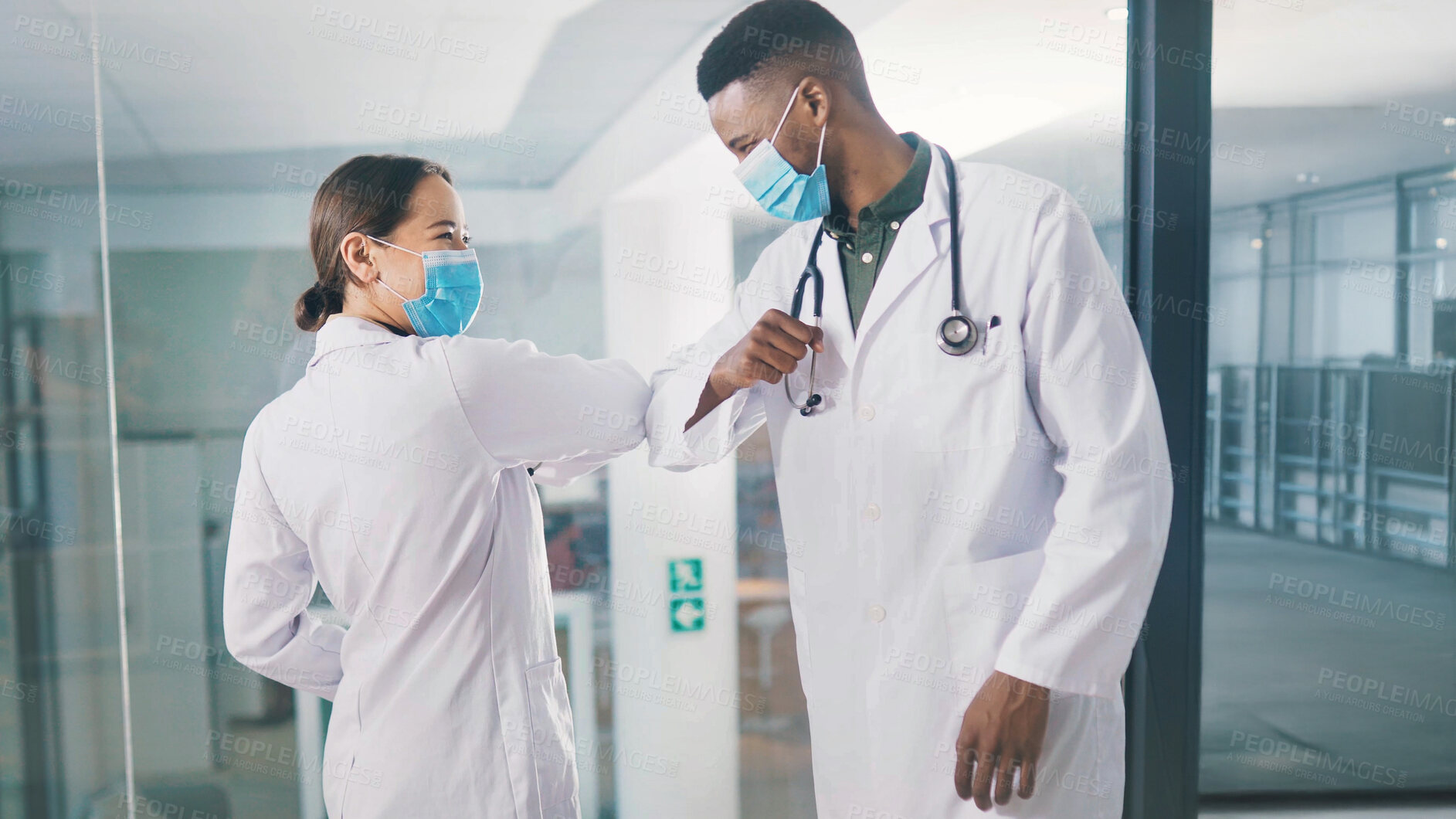 Buy stock photo Medical, face mask or people in clinic with elbow bump, greeting or regulation in virus protection. Healthcare, hello or doctor in hospital with gesture, Covid 19 or social distance in pandemic rules