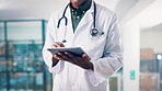 Tablet, black man and hands of doctor in hospital with medical research for diagnosis or treatment plan. Technology, email and African male healthcare worker with online communication in clinic.