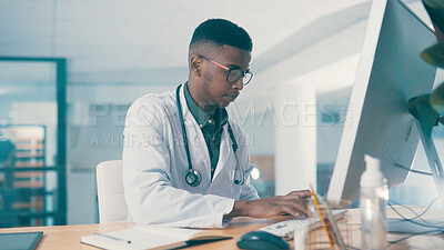 Buy stock photo Black man, doctor and typing on computer for wellness, telehealth report or insurance records. Desktop, serious and medical worker with healthcare history, clinic schedule and research in office