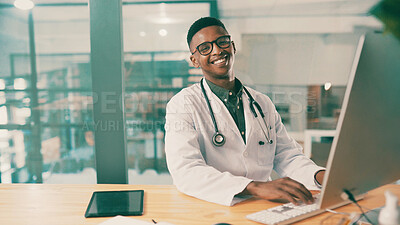 Buy stock photo Computer, healthcare and portrait with doctor black man at desk in hospital for results review. Medical, research and typing with medicine professional in office at clinic for agenda or schedule