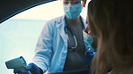 Doctor, face mask and car with screening results for temperature, fever or safety in city. Woman, healthcare worker or medical exam with infrared scanner for viral assessment or outbreak regulations