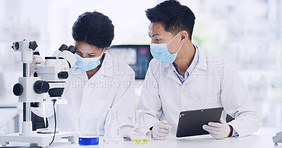 Buy stock photo Science, team and microscope in lab for chemistry, review or medical development with tablet. Scientist, collaboration and people with biotechnology for study, vaccine research or planning with PPE