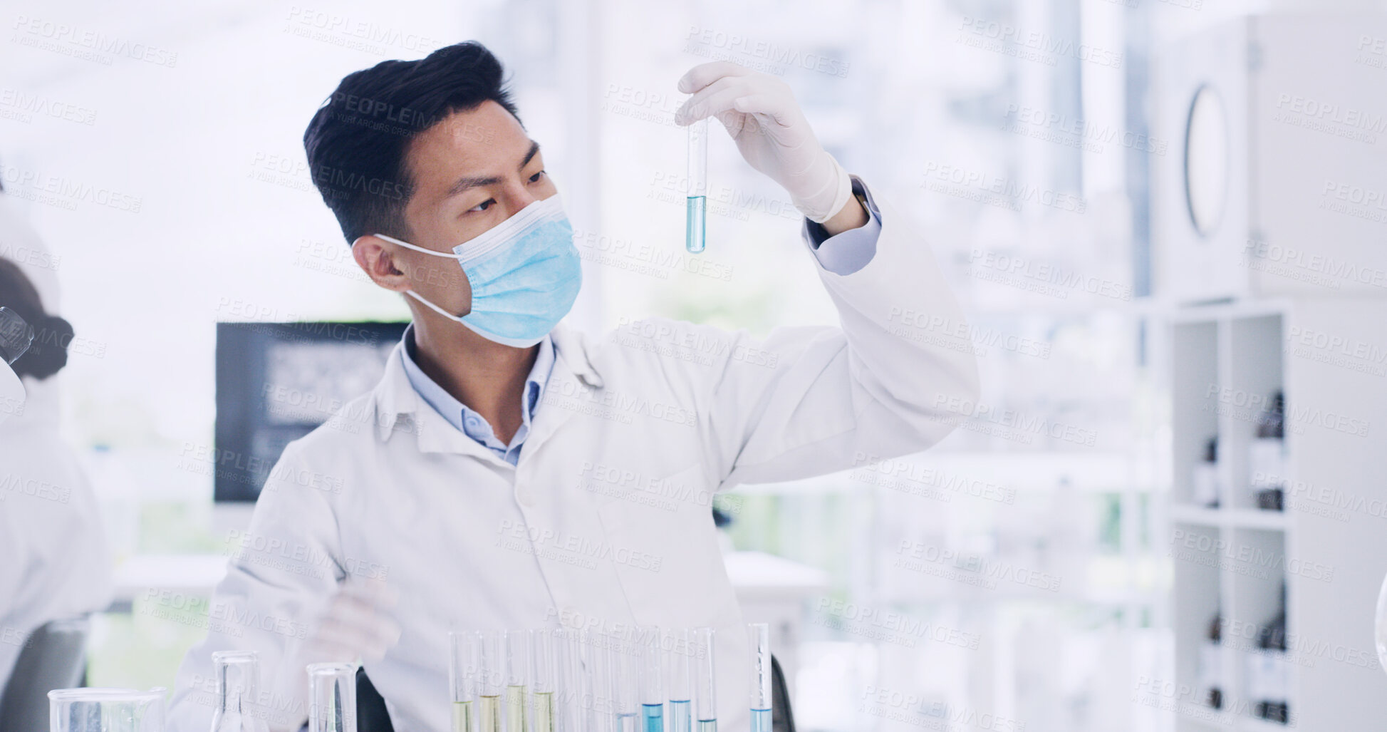 Buy stock photo Man, scientist or vial with mask in laboratory for medical research, chemical compound or discovery. Male person, science and checking liquid for scientific experiment, chemistry or study of medicine