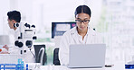 Laptop, woman and scientist in laboratory for research, medical project or healthcare innovation. Science, reading and female biologist with clinical trial for pharmaceutical development on computer.