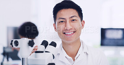 Buy stock photo Portrait, scientist and Asian man in laboratory with microscope, medical research and development. Smile, science and face of person with microbiology equipment, professional and career pride