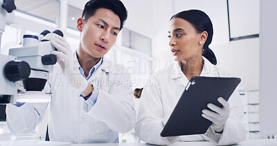 Buy stock photo Science, microscope and team with tablet in laboratory for microbiology, innovation or planning. Scientist, collaboration and people with technology for review, pharma research or medical development