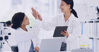 Buy stock photo Tech, research and women with high five, science and cure with medical study, app and support. Achievement, people and scientists in lab, laptop and tablet with gesture, teamwork and new discovery
