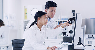 Buy stock photo Lab, scientists and people with computer, teamwork or medical research with tech to identify cancer. Woman, discussion and man with microscope for disease diagnosis, point and collaboration for cure