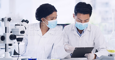 Buy stock photo Lab, scientists and people with tablet, discussion and innovation with microscope to identify cancer. Talking, man and woman with tech for disease diagnosis, teamwork and medical research for cure