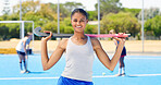 Portrait, hockey and happy woman on field for exercise, fitness and competition outdoor for health. Girl, athlete and player with stick for training, smile and confidence for sports with game