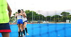 Hockey, team and women with hug outdoor for practice win, match performance and training success. Sport, fitness and happy players with embrace on pitch for game achievement, exercise and well done