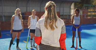 Buy stock photo Hockey, talking and back of coach with women outdoor for training, practice and match strategy. Sports hobby, fitness and people on turf with exercise for playing game, competition and tournament
