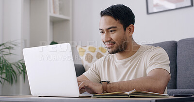 Buy stock photo Man, student and laptop with typing in home, smile and review project for online course in lounge. Person, happy and computer with notebook, assessment or elearning with research on web at apartment