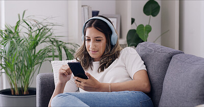 Buy stock photo Phone, relax and woman with headphones in home, streaming service or music on internet. Mobile, audio and happy person in living room for playlist search, online sound and listening to podcast