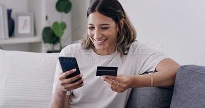Buy stock photo Credit card, phone and smile with woman on sofa for online shopping, banking app and password. Digital purchase, coupon code and ecommerce with person in living room of home for bills and fintech