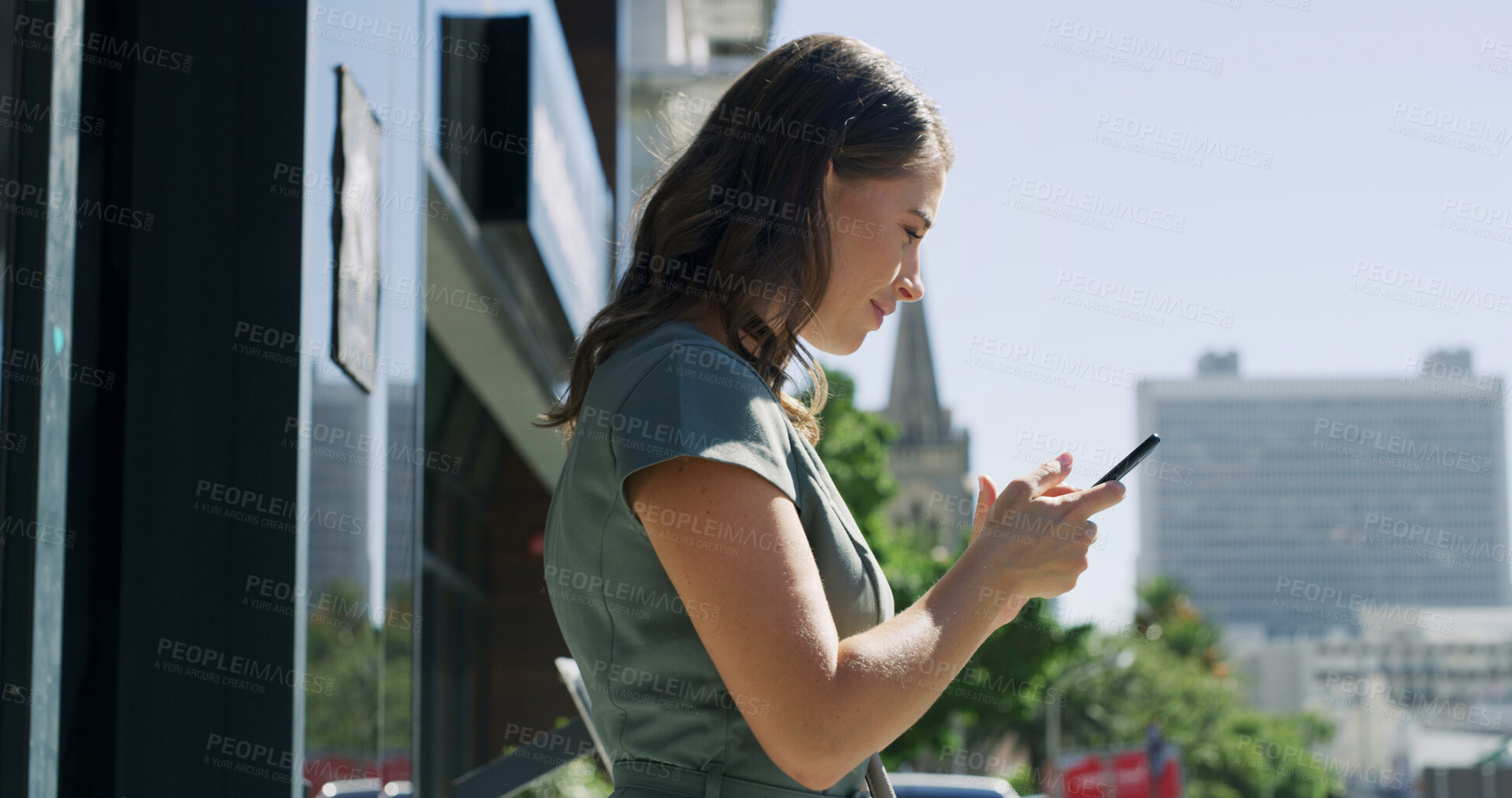 Buy stock photo City, phone and typing with business woman on balcony of office for social media or text message. App, connection and search with happy employee outdoor in urban town for mobile communication