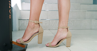 Buy stock photo Woman, foot and sanitizer dispenser for health, wellness or virus prevention with heels. Feet, sanitation or person with hygiene in office, bacteria safety or clean with germ disinfection in business