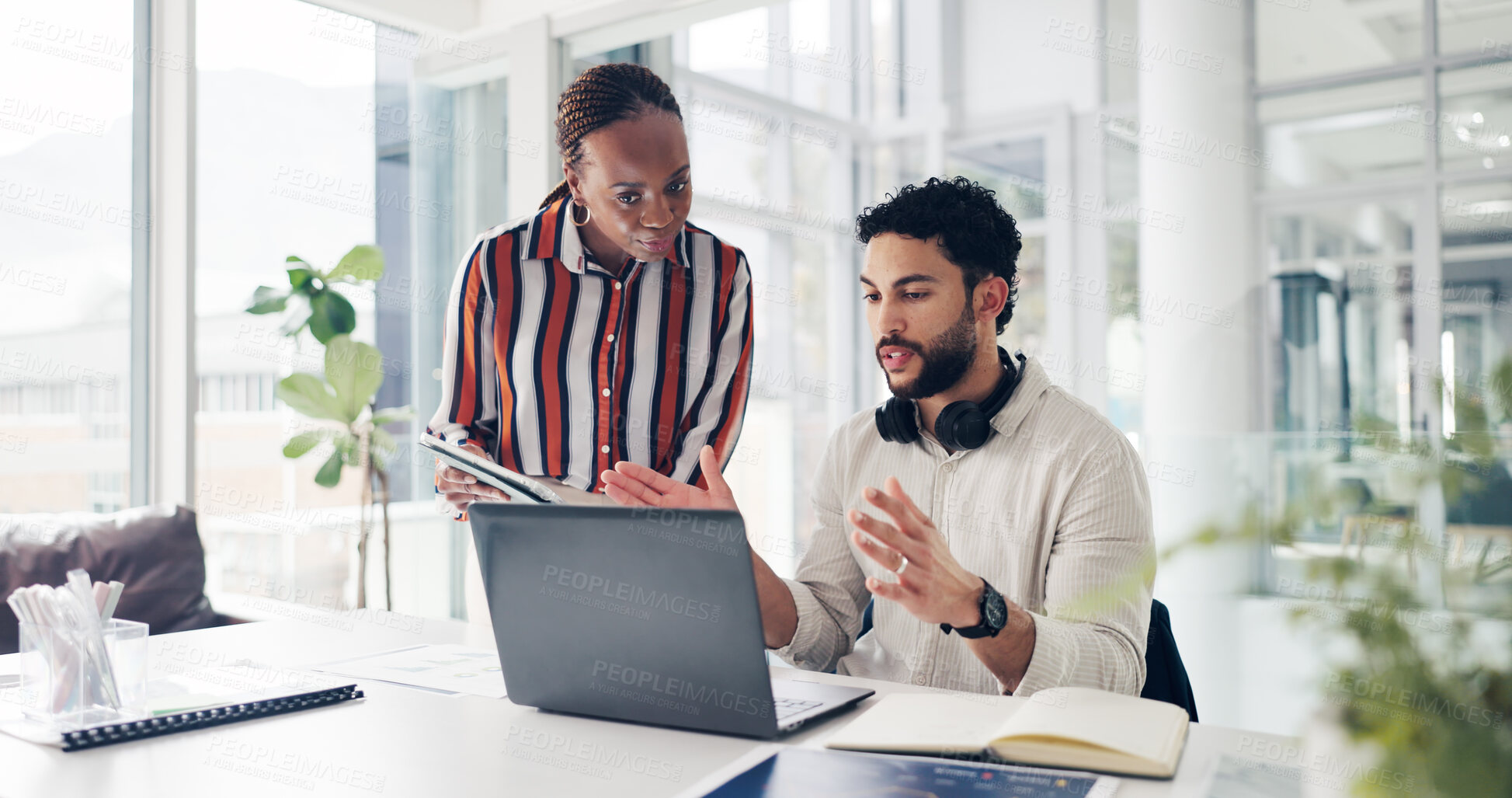 Buy stock photo Man, woman and discussion with laptop at startup, documents and review proposal at media company. People, team and computer with paperwork, writer and collaboration with feedback at creative agency