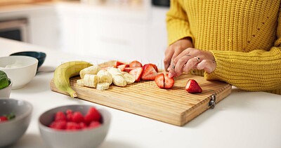 Buy stock photo Person, hands and cutting strawberry with board in kitchen for smoothie, nutrition or meal prep. Closeup, health or nutritionist with ingredients or organic fruit for dietary, wellness or vitamins