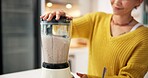 Smoothie, nutrition and hands with blender, kitchen and healthy drink for protein boost or breakfast. Vegetarian, wellness and person with liquid for gut health benefits, home and detox with beverage
