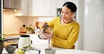 Pouring, smoothie and woman with blender, kitchen and healthy drink for nutrition boost and protein. Vegetarian, wellness and person with liquid for gut health benefits, home and detox with beverage