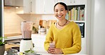 Woman, smoothie and smile in kitchen, portrait and excited with glass for gut health benefits in home. Girl, happy and blender with organic drink, diet or nutrition for detox at house in Colombia