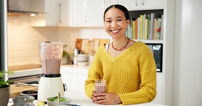 Buy stock photo Woman, smoothie and smile in kitchen, portrait and excited with glass for gut health benefits in home. Girl, happy and blender with organic drink, diet or nutrition for detox at house in Colombia