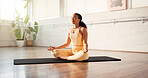 Yoga, woman and calm with meditation in studio for stress relief, mindfulness and inner peace. Yogi, zen and person with lotus pose on mat for holistic wellness, spiritual healing and chakra balance