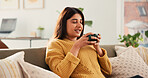 Calm, drink or Indian woman on sofa with coffee cup, satisfied or reflection in morning routine. Smile, aroma or female person in house with mug, mood improvement or mindfulness at start of day.