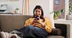 Cellphone, happy and woman on sofa in home with networking, communication or social media on mobile app. Smile, relax and female person with phone for texting, contact or chatting in living room.