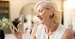 Reading, message and woman with smartphone, home and communication with contact on social media app. Review, online and mature person with mobile for texting, happy and notification on website